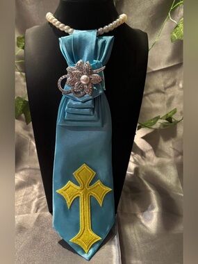 Women Light Blue Satin Neck Tie with Pearl Brooch and Yellow Cross Accent